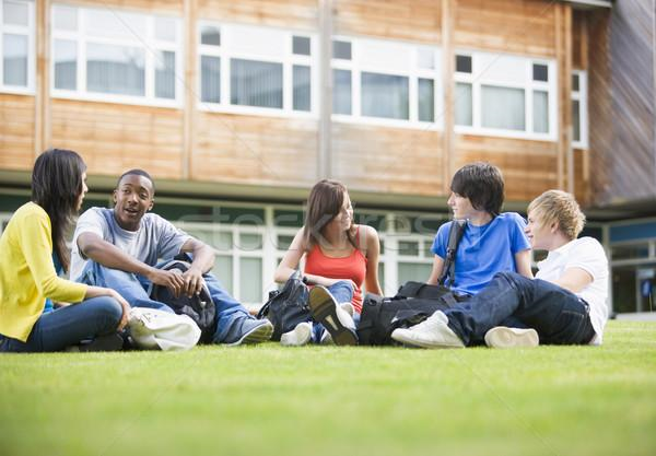 Students discuss education essay topics. 